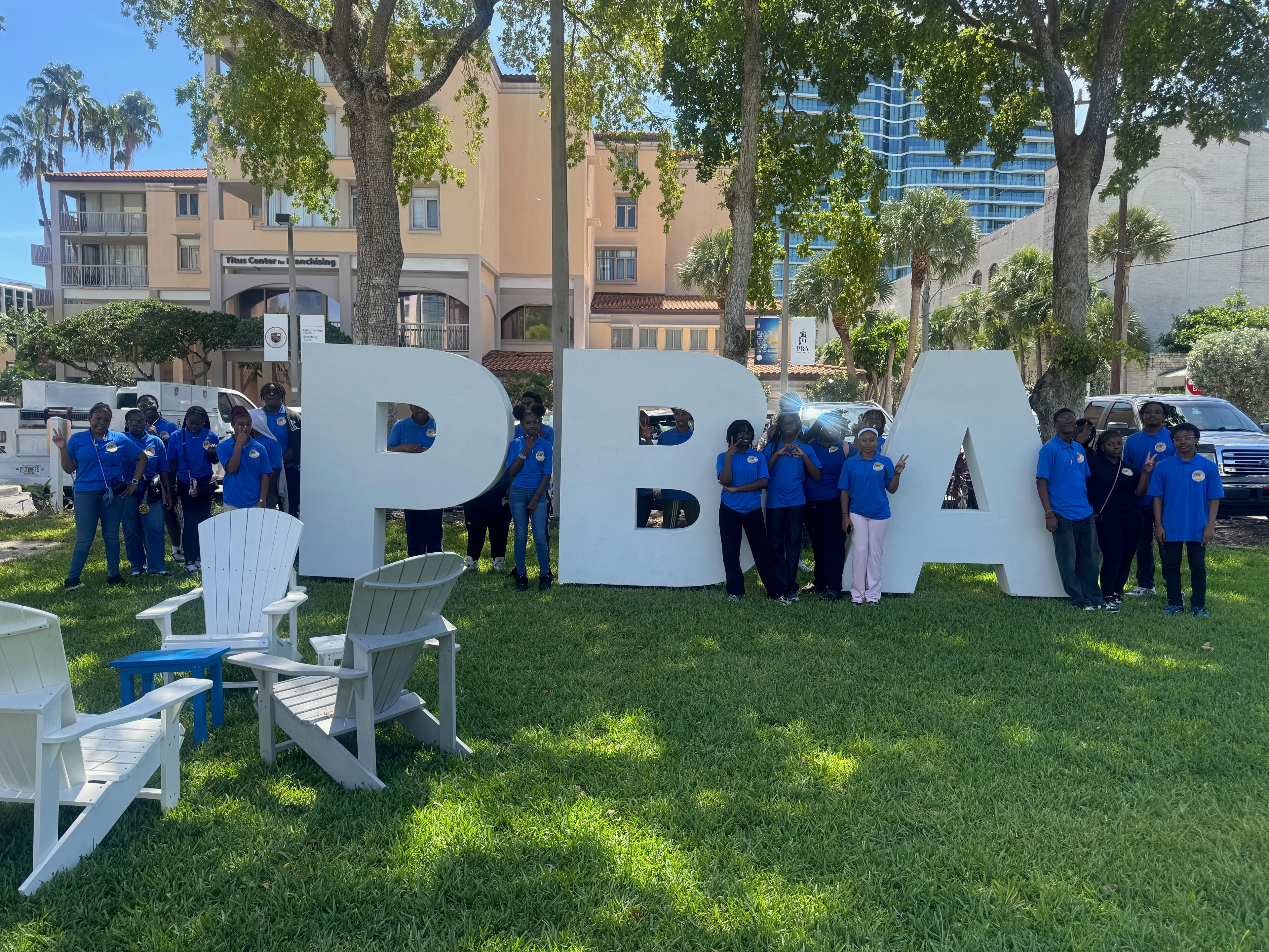 Students posing with PBA letters on campus